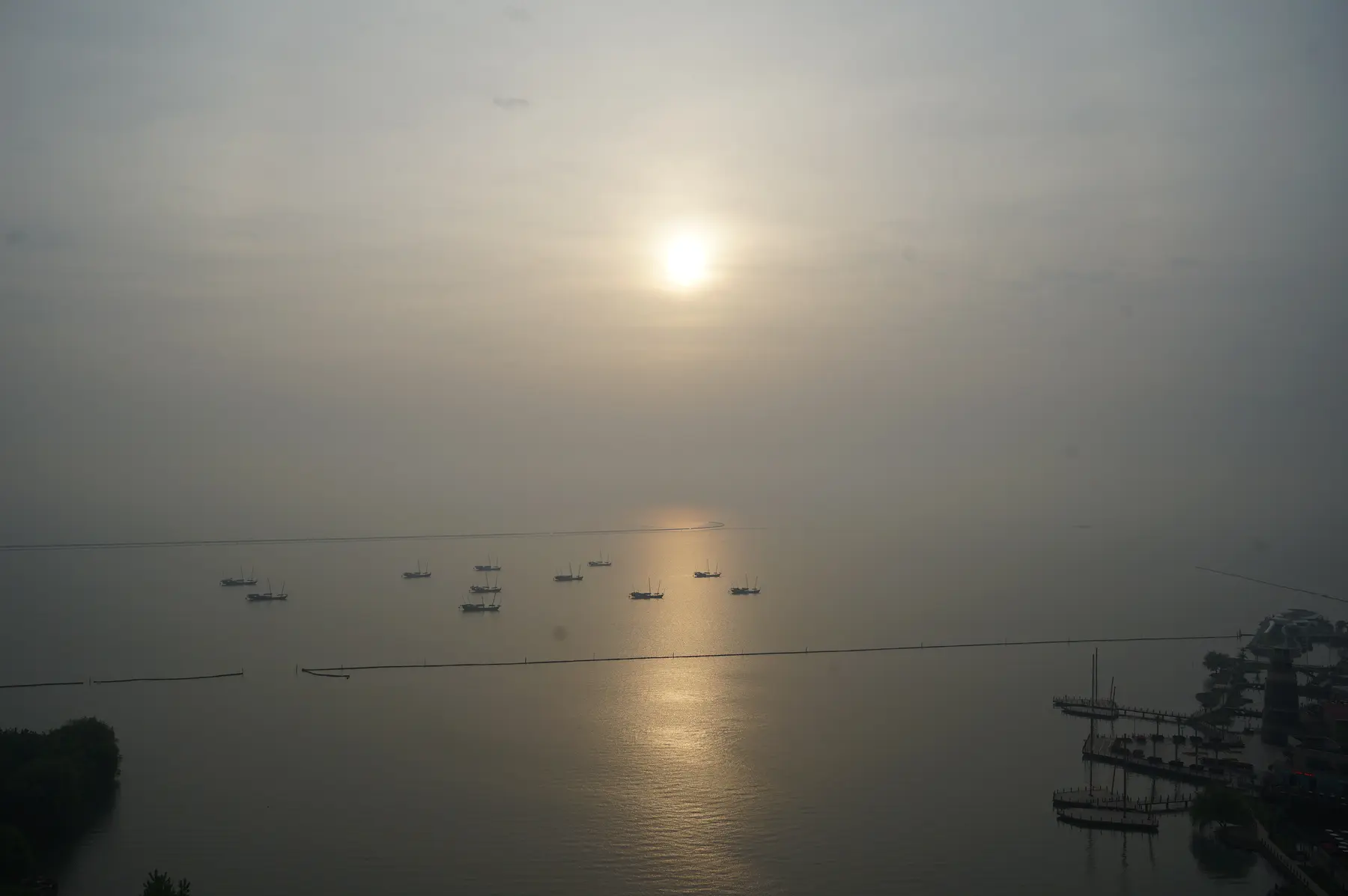 Sunlight reflected across a calm bay